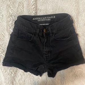Tight black stretchy jean shorts with working zipper and button, great quality.